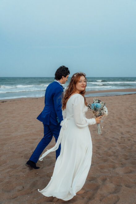 Couple photo on the beach after their wedding ceremony in Spain
